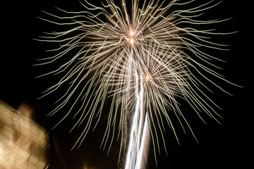 fireworks exploding in the sky during celebration at local holiday