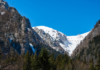 Bucegi mountain massif with snow as part of Carpathian mountains in Romania in winter