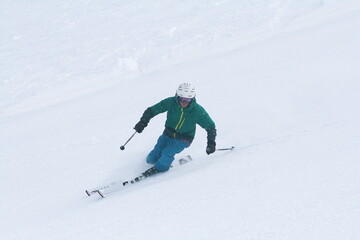 Fototapeta na wymiar A skier on a snow-covered slope, Sochi, Russia.