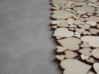 valentine's day greeting card-wooden hearts on a gray suede background. High quality photo