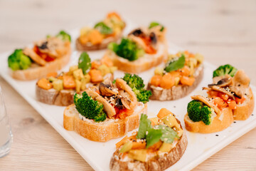serving the table with sandwiches on bruschetta for the holiday. 