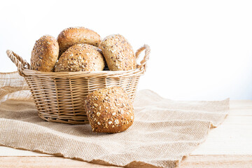 Baguette bread. Rye bakery with crusty loaves and crumbs. Fresh loaf of rustic traditional bread with wheat grain ear or spike plant on natural cotton background. Concept - Cooking at Home.