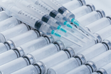 Medicine, Injection, vaccine and disposable syringe, drug concept. Sterile vial medical syringe needle. Glass medical ampoule vial for injection.