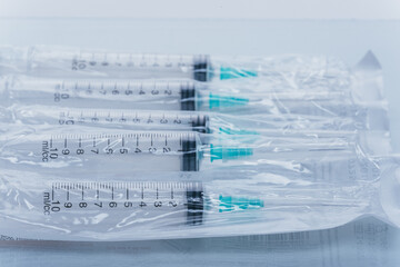 Medicine, Injection, vaccine and disposable syringe isolated, drug concept. Sterile vial medical. Macro close up on backgrounds gray.