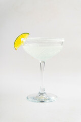 Isolated glass of margarita cocktail with lime and salt