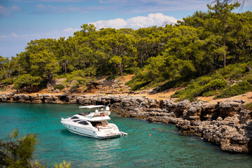 Plakat People relax and fish on a yacht on the seashore in the region of Kemer, Turkey.