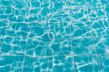 Fototapeta na wymiar Surface of blue swimming pool, texture of water in swimming pool.