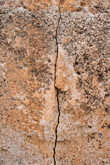 Grunge stone wall with crack in industrial building, great for your design and texture background