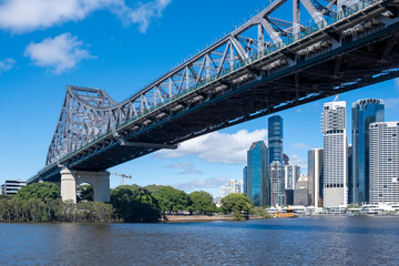 The Story Bridge over the Brisbane River with the Brisbane skyline in the background underneath 