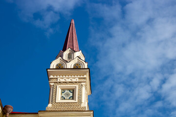 The tower in Rybinsk Russia on the museum building against the blue sky on a clear spring day