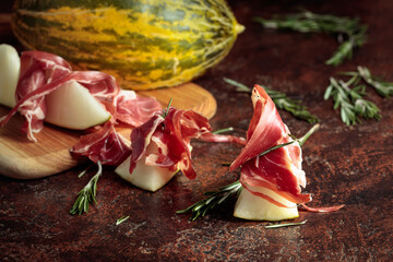 Juicy melon with prosciutto and rosemary.