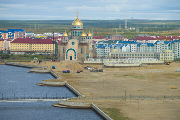 View of construction of new Orthodox church in the August cloudy afternoon. Salekhard