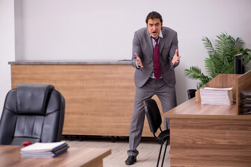 Fototapeta premium Young businessman employee in bullying concept in the office