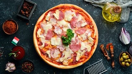 Homemade pizza with bacon, chicken and salami sausage. Top view. free space for your text. Rustic style.