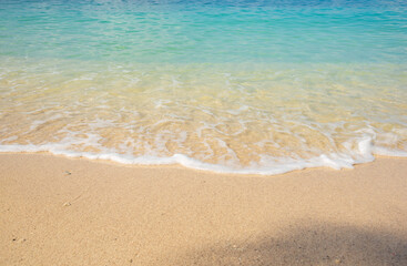 Fototapeta na wymiar sand beach with waves background