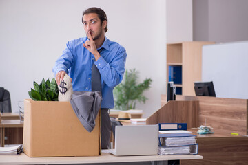 Young male employee being fired from his work