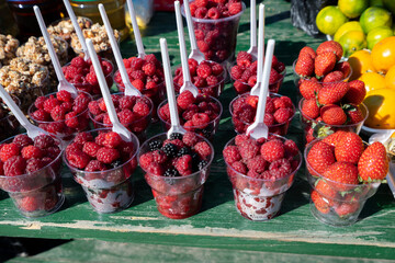 Fresh fruit stall, strawberry, raspberry, orange - 426965173