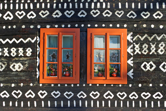 Unique decoration of log houses based on patterns used in traditional embroidery in village of Cicmany village, Slovakia