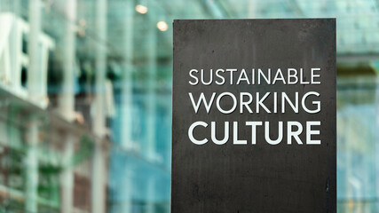 Sustainable Working Culture sign in front of a modern office building