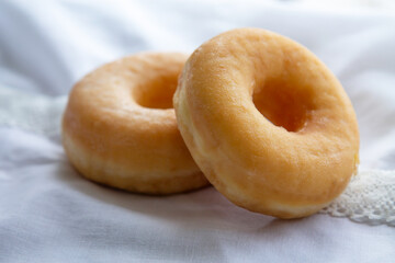 delicious sugary donuts on the tablecloth
