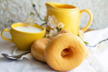 delicious donuts with cup on the table