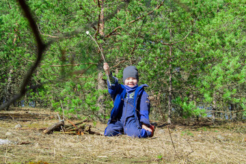 A child is playing in the street