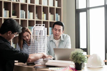 Heads of each department meeting together between Construction Engineers or Architect and Sales. Brainstorm management an idea to find a way to deal with construction and communication for sales.