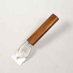 knife for making leather on a white background