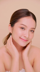 Beautiful face of Asian young woman with natural skin. Portrait of attractive girl with soft makeup and perfectly beautiful skin.