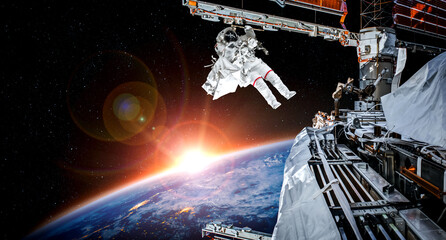 Astronaut spaceman do spacewalk while working for space station in outer space . Astronaut wear full spacesuit for space operation . Elements of this image furnished by NASA space astronaut photos. © InfiniteFlow