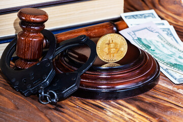 bitcoin, judge's hammer, handcuffs. Concept bitcoin ban, violation of the law.