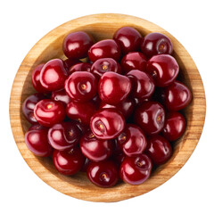 wooden bowl of sweet cherry fruits isolated on white background