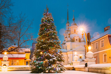 Parnu, Estonia. Christmas Tree In Holiday New Year Festive Illumination And St. Katherine Orthodox...