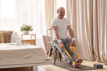 Man sitting on chair doing paschimottanasana or Intense Dorsal Stretch pose