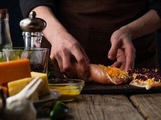 Chef prepares meatloaf for baking, on the background of ingredients.Culinary recipes and cooking