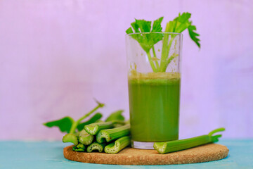 Healthy Celery diet for the treatment of incurable mysterious diseases. Fresh celery juice squeezed out on a juicer.drink, vegetable juice, studio shot