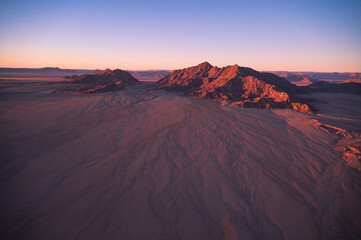 Amazing nature texture, aerial view of the red desert in Namibia, Africa.