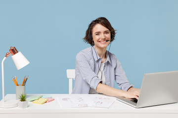 Young operator fun employee business woman in shirt set microphone headset helpline assistance sit...