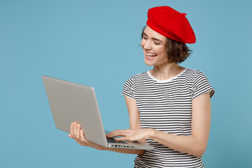 Young freelancer copywriter woman 20s with short hairdo wear french beret red hat striped tshirt...