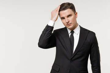 Young confident caucasian successful employee business corporate lawyer man in classic formal black grey suit shirt tie work in office correct hairstyle isolated on white background studio portrait