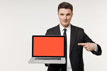 Young employee business corporate lawyer man in classic formal black grey suit shirt tie work in office point finger on laptop pc computer blank screen workspace area isolated on white background