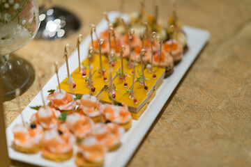 buffet food, catering food party at restaurant, mini canapes, snacks and appetizers