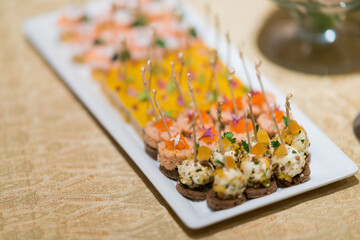 buffet food, catering food party at restaurant, mini canapes, snacks and appetizers