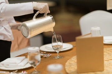 pour water, glass water, glass on table