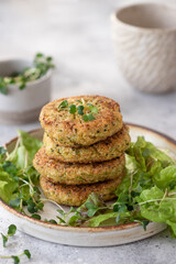 Vegan burgers with quinoa and broccoli in ceramic plate. Healthy vegan food concept. vertical image, close-up