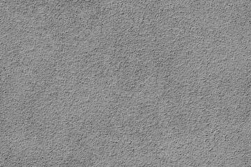 Stucco - seamless texture, photo. Gray Plaster rough facade finish. Natural stone covered with cement mortar. 