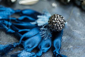 Close up silver bead on large blue flower