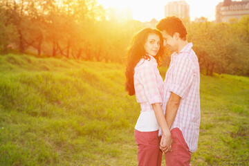 Happy couple in Love. Male and woman in sunset light. Love story - concept.