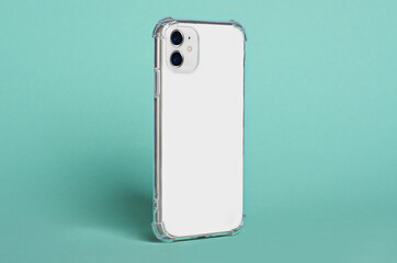 White iPhone 11, 12, side view isolated on green background, clear phone case mockup, smartphone perspective view, rotated position