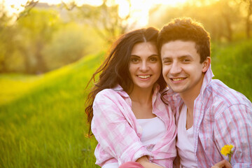 Fototapeta premium Love. Happy couple, man and woman sunset. Spring love story - concept.